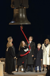 Clinton rings a replica of the Liberty Bell at her father's first inauguration